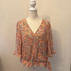 Sienna Sky floral wrap around 3/4 length sleeve blouse. Size S